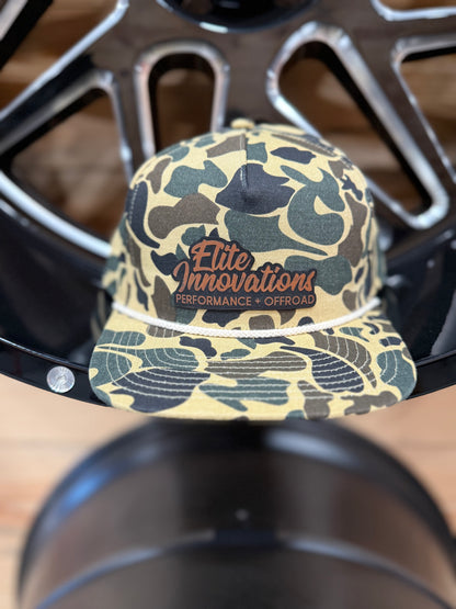 Premium camo snapback hats featuring the Elite Innovations logo, crafted in collaboration with PG Hat Co.