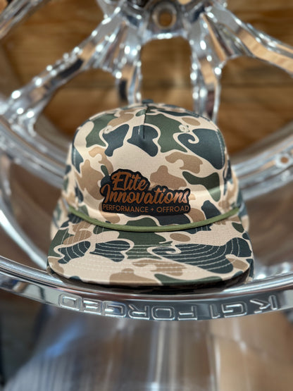 Premium camo snapback hats featuring the Elite Innovations logo, crafted in collaboration with PG Hat Co.