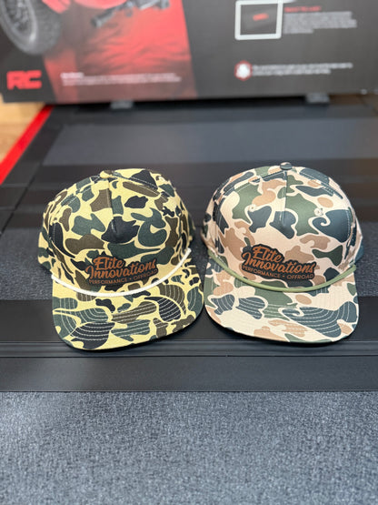 Premium camo snapback hats featuring the Elite Innovations logo, crafted in collaboration with PG Hat Co.
